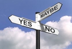 Concept image of a signpost with Yes, No or Maybe against a blue cloudy sky.